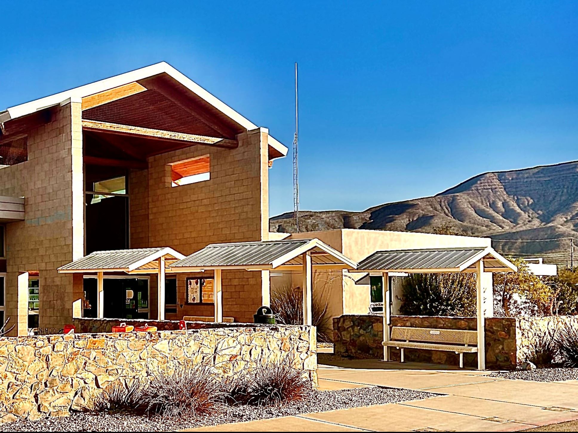 Alamo Senior Center Exterior front entrance with covered benches.